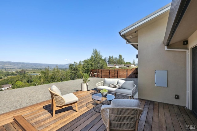 wooden terrace featuring an outdoor living space