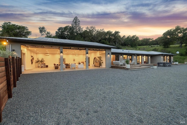 4127 Dry Creek Rd, Napa, CA 94558 - back of property at dusk featuring stucco siding and a patio