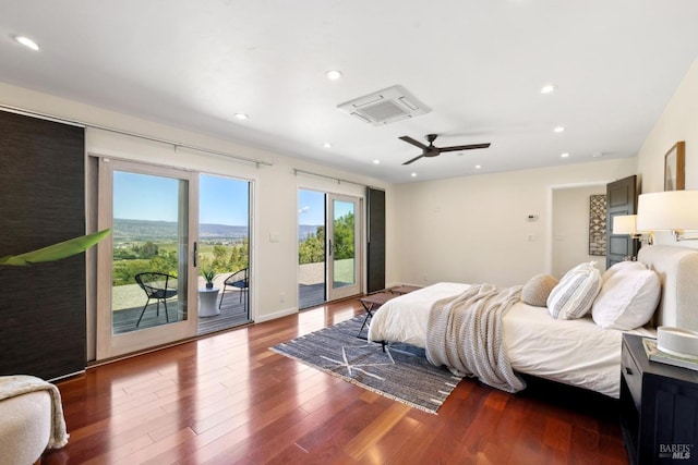 bedroom with access to outside, recessed lighting, and wood finished floors