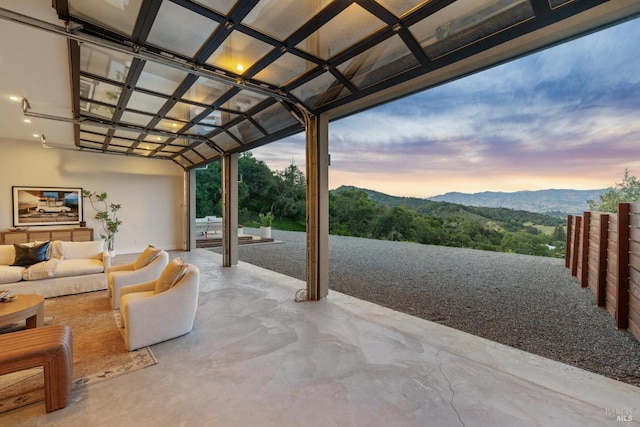 view of patio / terrace with a mountain view and an outdoor hangout area
