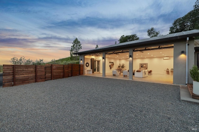 exterior space with a patio area, stucco siding, french doors, and fence