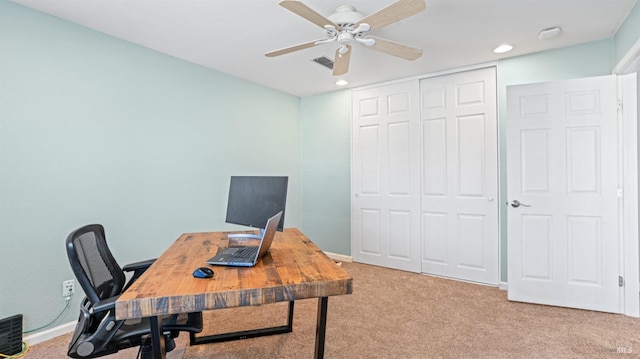 office with visible vents, baseboards, ceiling fan, and carpet flooring
