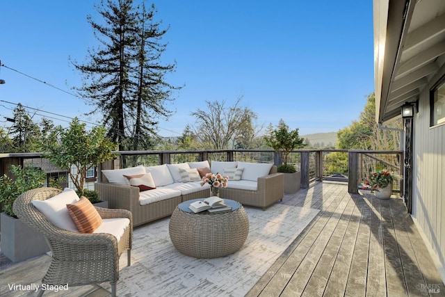 wooden terrace featuring outdoor lounge area