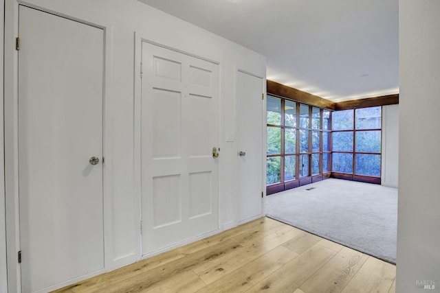 entryway featuring visible vents and wood finished floors