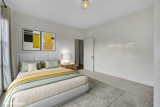 carpeted bedroom with baseboards
