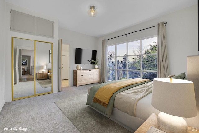 bedroom featuring light colored carpet