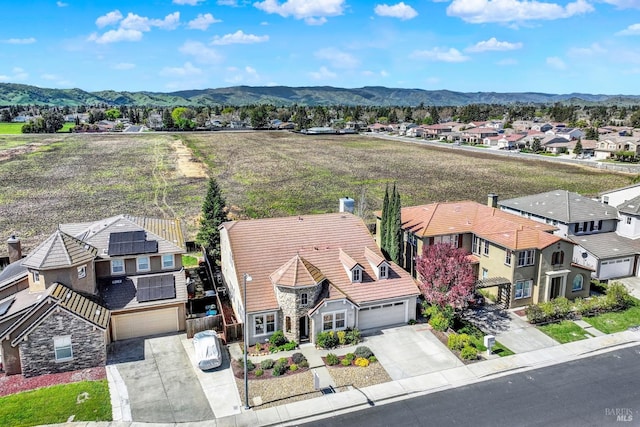 drone / aerial view featuring a mountain view and a residential view