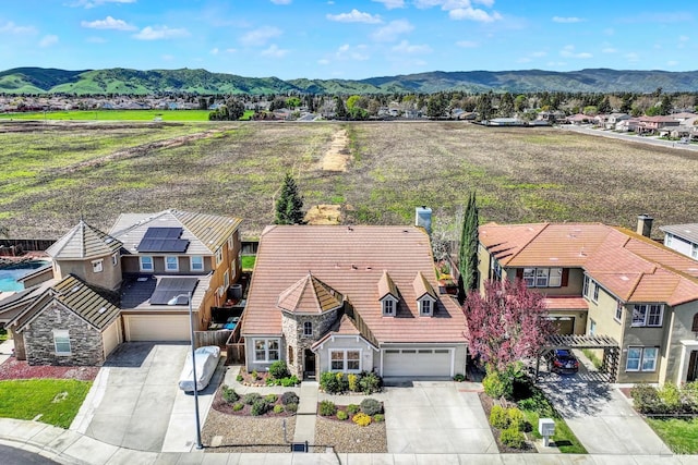 drone / aerial view featuring a mountain view and a residential view