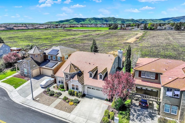 birds eye view of property with a mountain view