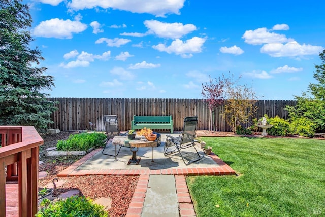 view of yard with a patio area and a fenced backyard