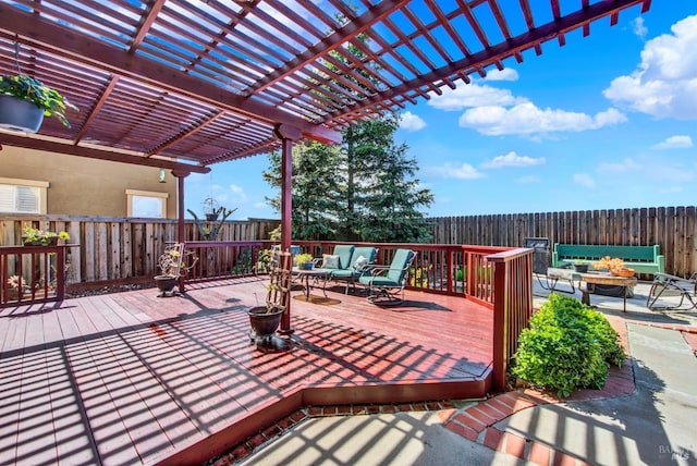 wooden terrace featuring a pergola and a fenced backyard