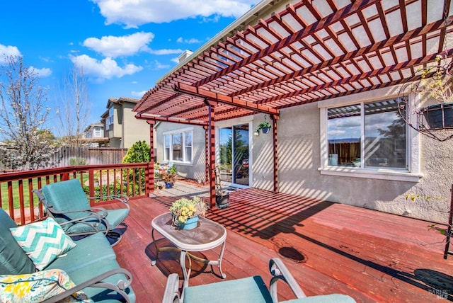 wooden terrace featuring a pergola and fence