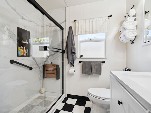 bathroom featuring tile patterned floors, toilet, a healthy amount of sunlight, and a marble finish shower