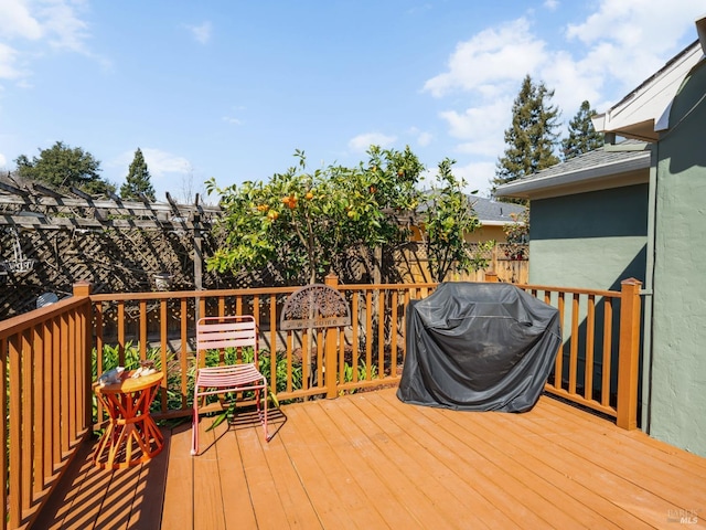 wooden deck with area for grilling