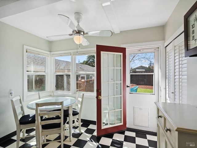 dining area with tile patterned floors, baseboards, and a ceiling fan