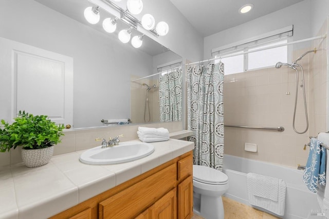 full bathroom with toilet, shower / bath combo with shower curtain, and vanity
