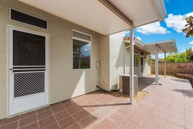view of patio / terrace with fence and central AC