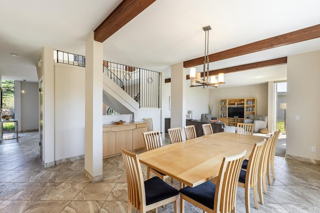 dining space with beamed ceiling, baseboards, a notable chandelier, and stairs