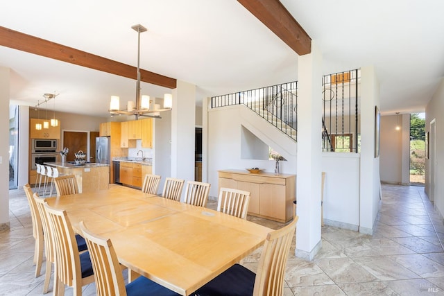 dining space with an inviting chandelier, stairway, baseboards, and beam ceiling