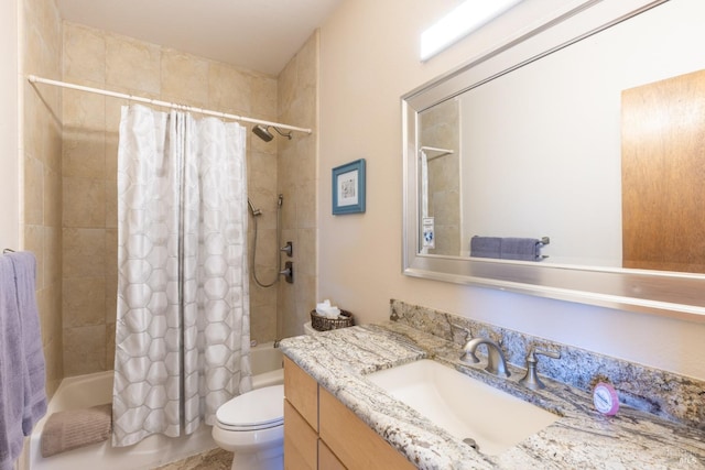 bathroom with shower / bathtub combination with curtain, toilet, and vanity