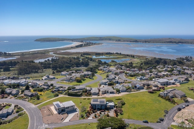 drone / aerial view with a residential view and a water view