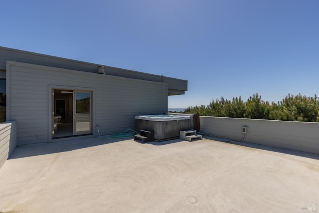 view of patio / terrace featuring a hot tub