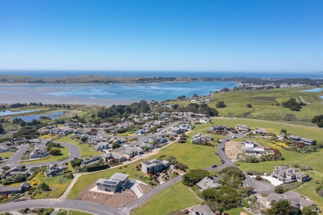 birds eye view of property with a residential view and a water view