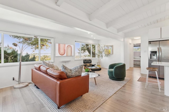 living room featuring wood ceiling, vaulted ceiling with beams, and light wood-style floors