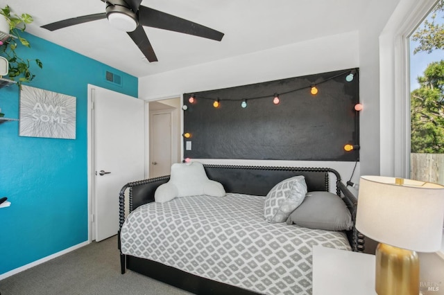 bedroom featuring carpet flooring, visible vents, and ceiling fan