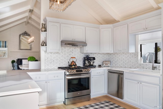 603 Sunnyside Rd, Saint Helena, CA 94574 - kitchen with lofted ceiling with beams, a chandelier, stainless steel appliances, under cabinet range hood, and a sink