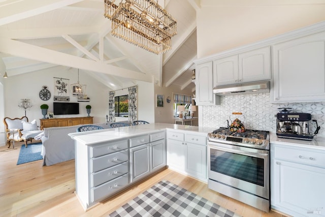 603 Sunnyside Rd, Saint Helena, CA 94574 - kitchen with a notable chandelier, stainless steel range with gas cooktop, under cabinet range hood, and a peninsula