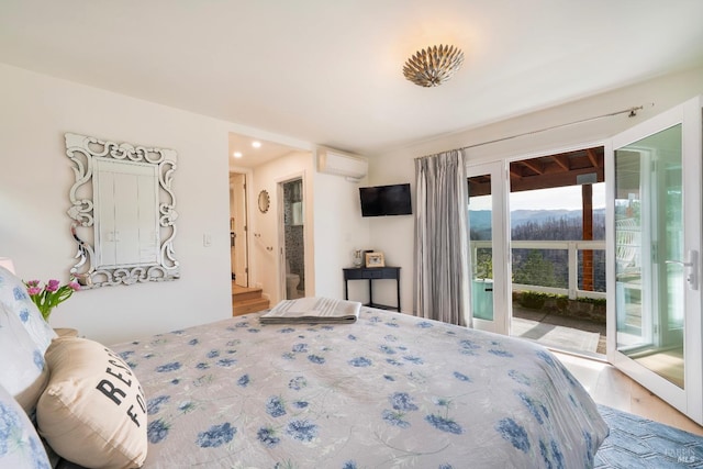 603 Sunnyside Rd, Saint Helena, CA 94574 - bedroom with a wall mounted AC, access to exterior, and wood finished floors