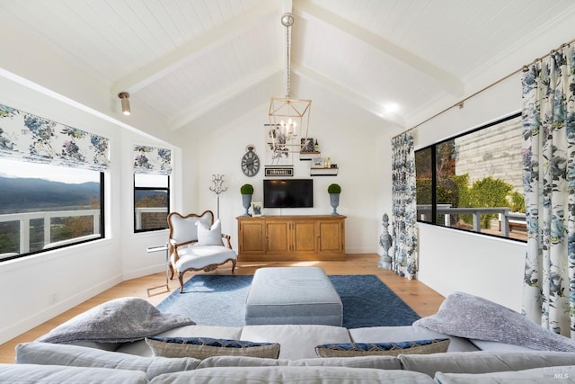 603 Sunnyside Rd, Saint Helena, CA 94574 - living area with lofted ceiling with beams, plenty of natural light, a notable chandelier, and light wood-type flooring