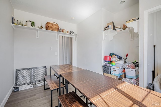 dining room with baseboards and wood finished floors