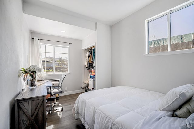 bedroom featuring baseboards, recessed lighting, and wood finished floors