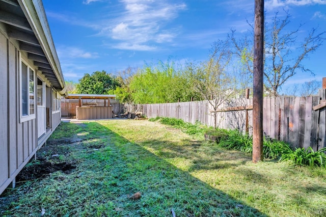 view of yard featuring a fenced backyard