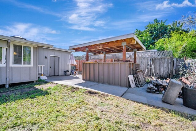 view of yard with a fenced backyard and a patio area