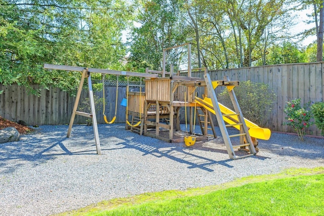 view of jungle gym with a fenced backyard