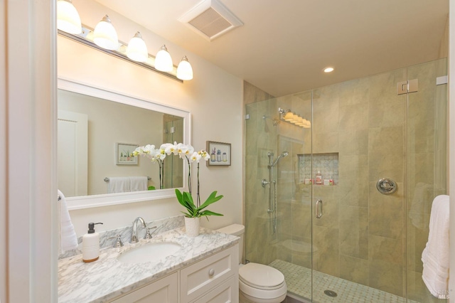 full bath featuring vanity, visible vents, recessed lighting, a shower stall, and toilet