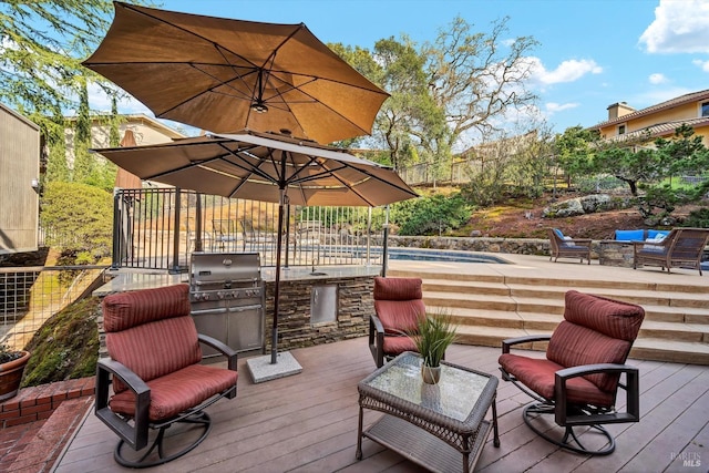wooden deck featuring outdoor lounge area and fence