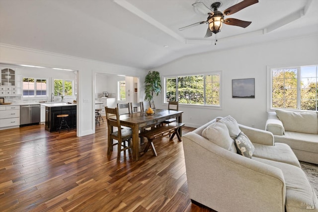 dining space with baseboards, dark wood-type flooring, ceiling fan, and lofted ceiling