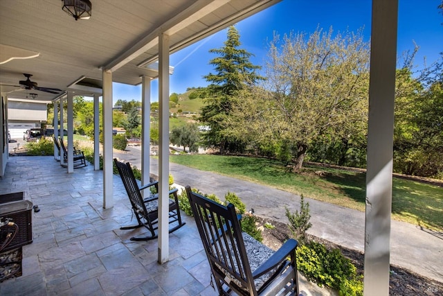 view of patio with ceiling fan and covered porch