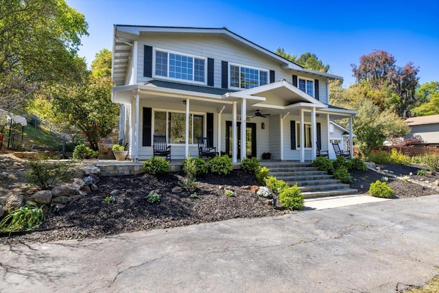view of front of house featuring a ceiling fan and a porch