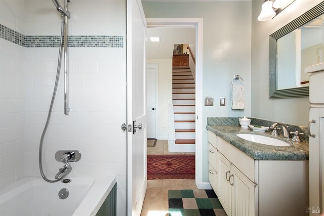 full bath featuring vanity and  shower combination