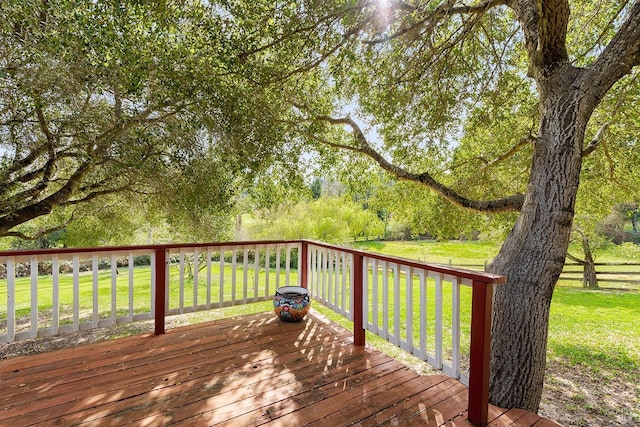 wooden terrace with a yard