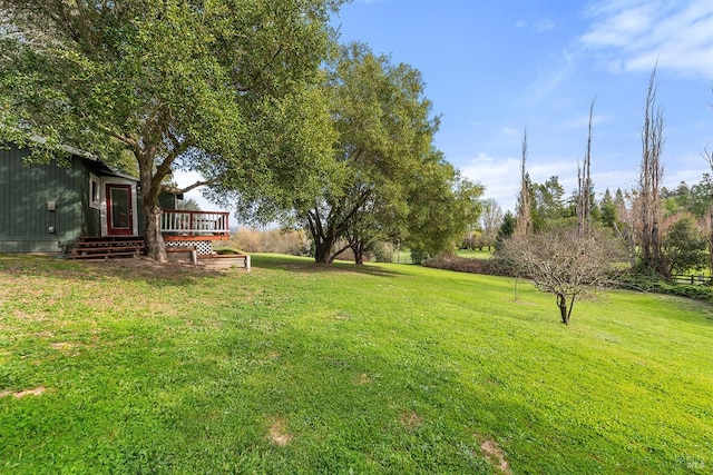 view of yard with a wooden deck
