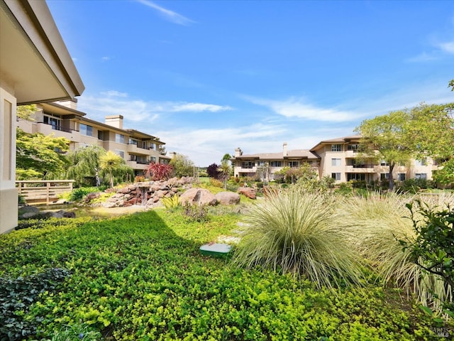 view of yard featuring a residential view