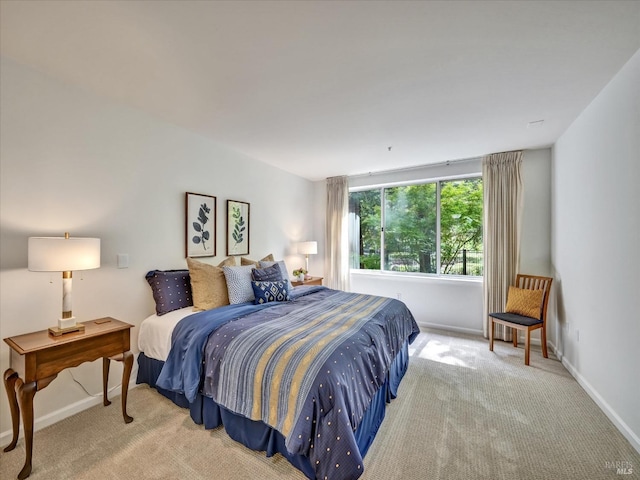 carpeted bedroom with baseboards