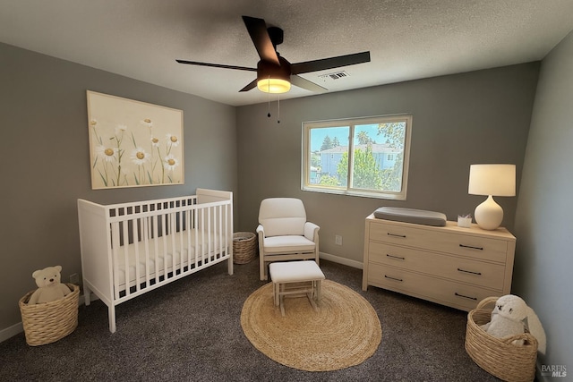 179 Midvale Dr, Vacaville, CA 95687 - carpeted bedroom with a crib, a ceiling fan, and a textured ceiling