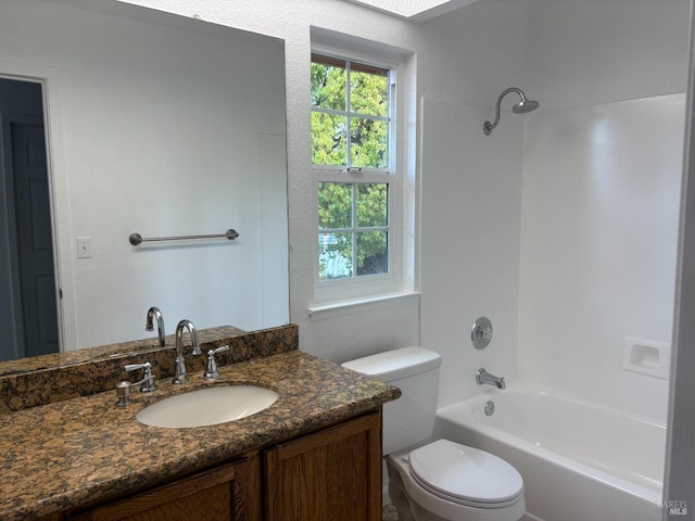 full bathroom featuring toilet, vanity, and bathtub / shower combination